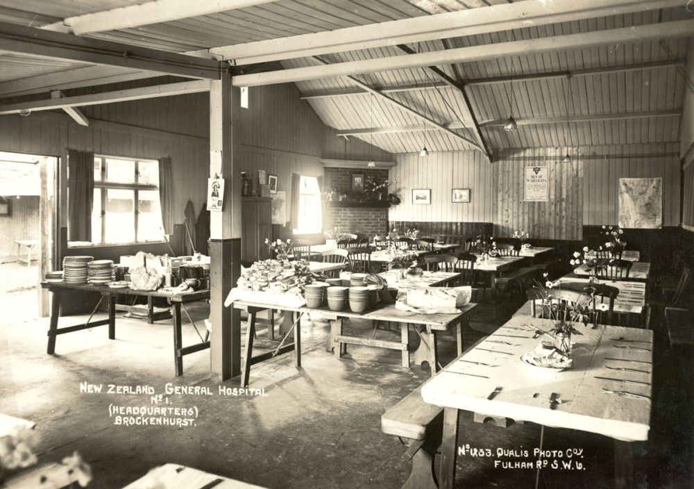 A mess hall with tables neatly laid at No 1 New Zealand General Hospital, Brockenhurst.